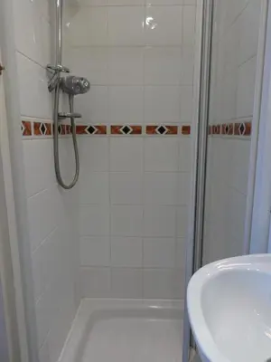 a bathroom with a shower and a sink at Dumfries Villa in Dumfries