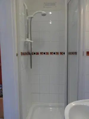 a bathroom with a shower and a sink at Dumfries Villa in Dumfries