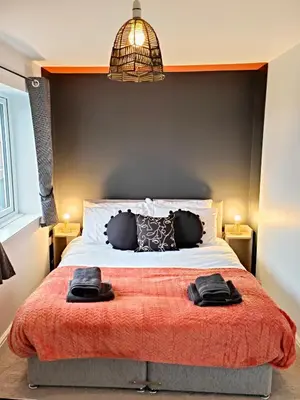 a bedroom with a bed with two towels on it at Carvetii - Phoenix House - Near Hospital, max 8 ppl in Carlisle