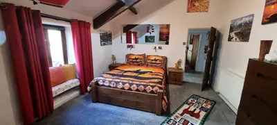 a bedroom with a bed and a window at The Big 