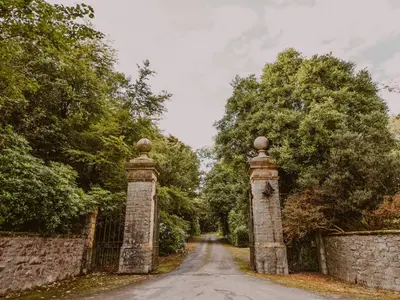 a gate at the end of a road at Rose Blair Lodge - Uk31045 in Portpatrick