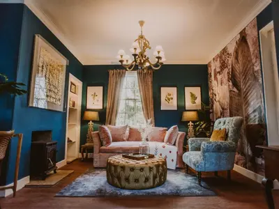 a living room with a couch and a chandelier at Rose Blair Lodge - Uk31045 in Portpatrick