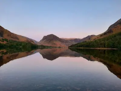 a view of a lake with mountains in the background at Buttermere Court Hotel in Buttermere