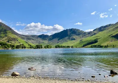 a view of a lake with mountains in the background at Buttermere Court Hotel in Buttermere