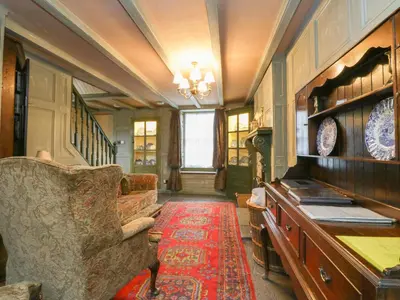 a living room with a couch and a table at The Precinct House in Newton Stewart
