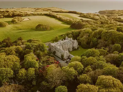 an aerial view of a castle surrounded by trees at The Royal Apartment - Uk31086 in Portpatrick