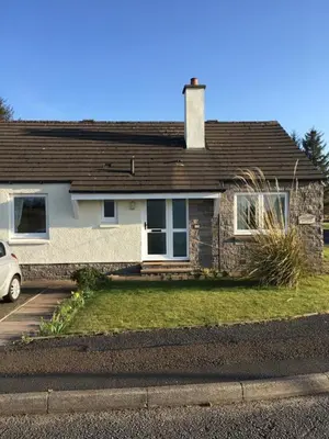 a house with a car parked in front of it at Lavender Cottage with Parking and Beautiful Views Christmas Special in Carsphairn