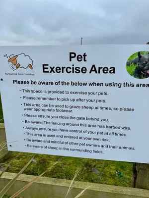 a sign for a pet exercise area at Bunnahabhain 5 - Farm Stay - Stunning sea and rural views in Stranraer