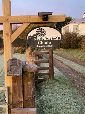 a sign for a clinton archaeologyuseumuseumuseumuseumessen at Jacquie's B&B -Dumfries-Room with a view in Dumfries