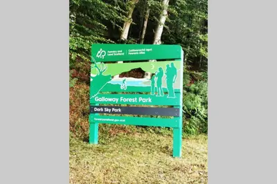 a sign for the caledonian forest park at 2 Calgow Cottages in Newton Stewart