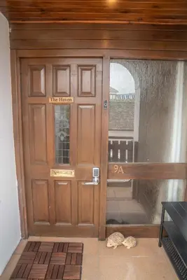 a front door of a house with a sign on it at The Haven Keswick - Spacious Central Apartment in Keswick