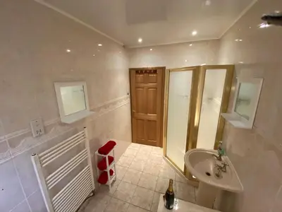 a bathroom with a sink and a toilet and a shower at Country Cottage Sleeps 6 w Hot Tub & Dog-Friendly in Moniaive