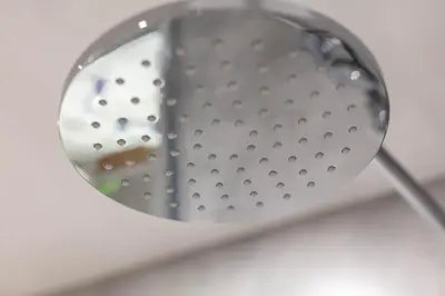 a magnifying glass on top of a sink at Waverley Suite No57 - Donnini Apartments in Ayr