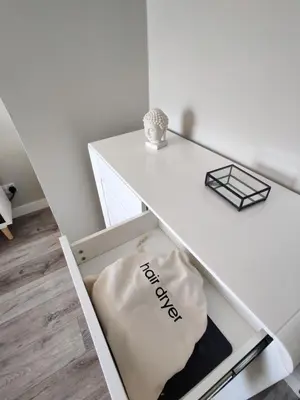 a white table with a bag in a drawer at Anchors Away in Ayr