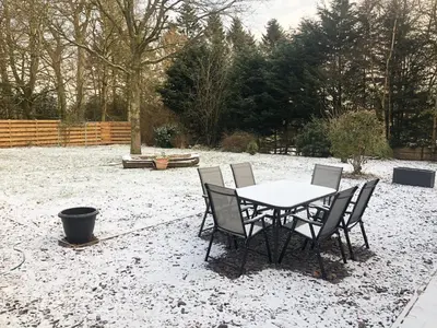 a table and chairs in a yard covered in snow at Terraughtie Cottage East-Uk31767 in Terreglestown