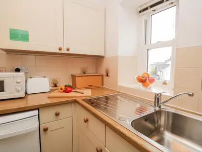 a kitchen with a sink and a microwave at Oak View in Keswick