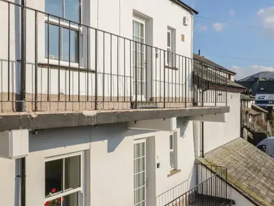 a white building with balconies on the side of it at Oak View in Keswick
