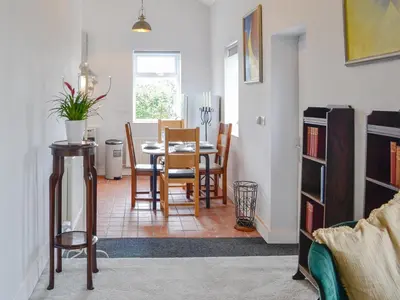 a kitchen and dining room with a table and chairs at Old Reading Room in Cotehill