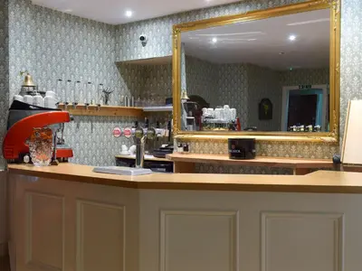 a mirror sitting on top of a counter in a kitchen at Machermore Castle in Newton Stewart