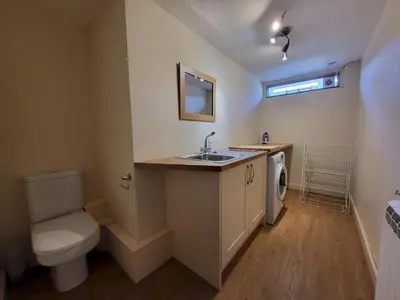 a bathroom with a sink and a toilet in it at Lingmell Fell View, Chapel Stile in Chapel Stile