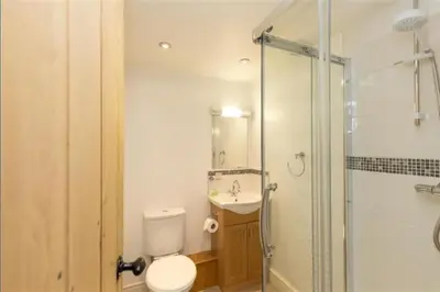 a bathroom with a toilet and a sink and a shower at Victory Cottage - Victory Cottage, Cosy village retreat in Chapel Stile