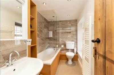 a bathroom with a sink and a toilet and a tub at Victory Cottage - Victory Cottage, Cosy village retreat in Chapel Stile