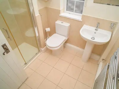 a bathroom with a toilet and a sink and a shower at Plumblands in Ambleside