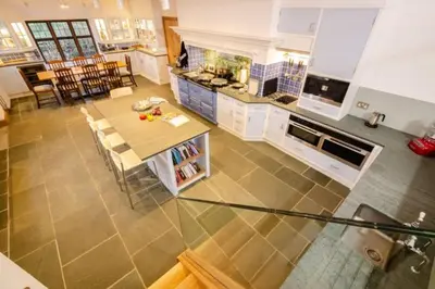 an overhead view of a kitchen with a table and chairs at Heron Place, Great Langdale in Ambleside