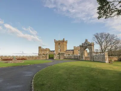 an image of a castle with a grass yard at Royal Artillery Cottage - Culzean Castle in Maybole
