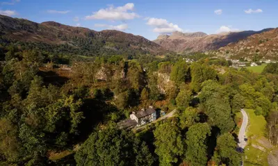an aerial view of a house in a forest at The Stable At Oakbank in Elterwater