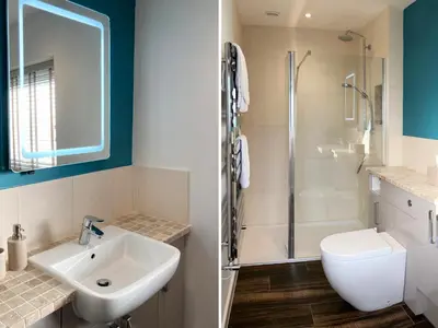 a bathroom with a sink and a shower and a toilet at Merlestead in Applethwaite