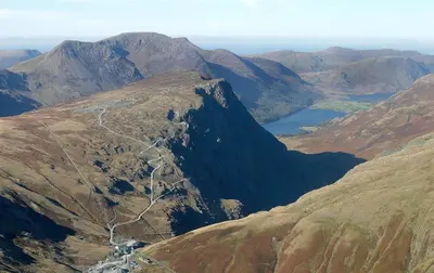 an aerial view of a mountain with a road on it at Grange Fell Borrowdale in Keswick