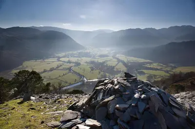 a large pile of rocks on top of a mountain at Grange Fell Borrowdale in Keswick