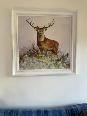 a painting of a deer on a wall at Heron Lodge, edge of Mabie Forest Dumfries in Dumfries