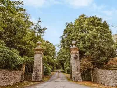 a gate at the end of a road at Fern Forest House- Uk31047 in Portpatrick