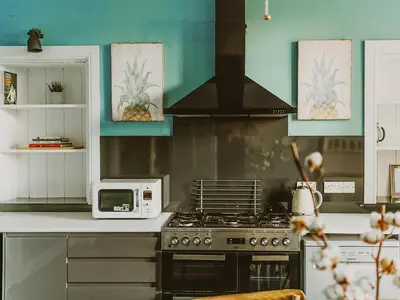 a kitchen with a stove and a microwave at Fern Forest House- Uk31047 in Portpatrick