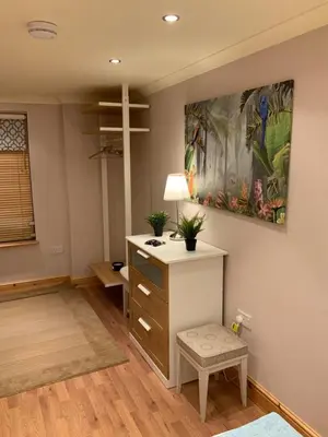 a room with a desk and a painting on the wall at Dove Cottage (Annex) in Workington