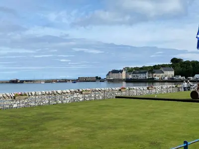 a park with a view of a body of water at Happydays Caravan 1 Newton Stewart in Bailliewhir