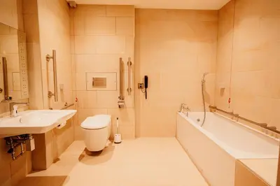 a bathroom with a toilet and a sink and a tub at The Fleece at Ruleholme in Carlisle