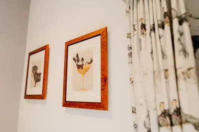 two framed pictures hanging on a white wall at The Fleece at Ruleholme in Carlisle