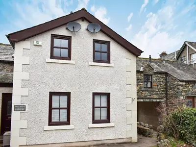 a white house with black windows on it at Walkers Retreat in Keswick