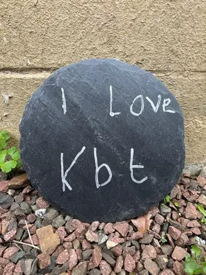 a rock with the words love keds written on it at The Blue Door in Kirkcudbright