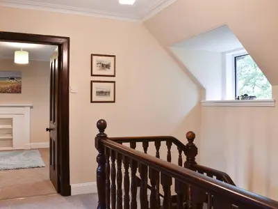 a staircase in a home with a stair case at Ingleside in Whiting Bay