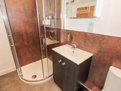 a bathroom with a sink and a shower at The Nook in Keswick