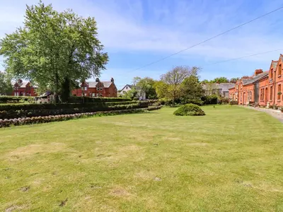 a large grassy yard in a residential neighborhood at Seascape in Annan