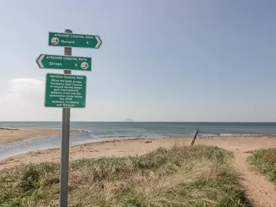 a street sign at the beach with the ocean at Ailsa Shores in Turnberry