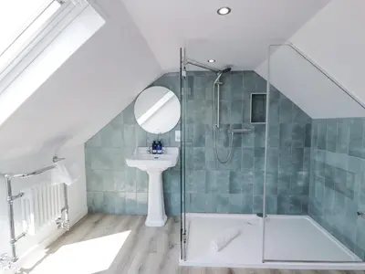 a bathroom with a shower and a sink at Ailsa Shores in Turnberry