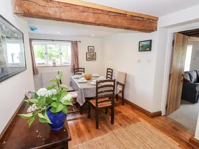 a dining room with a table and chairs at Two Town End in Penrith