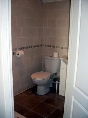a bathroom with a toilet and a sink at The Golden Lion Hotel in Maryport
