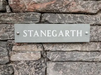 a sign on the side of a stone wall at Stanegarth in Keswick